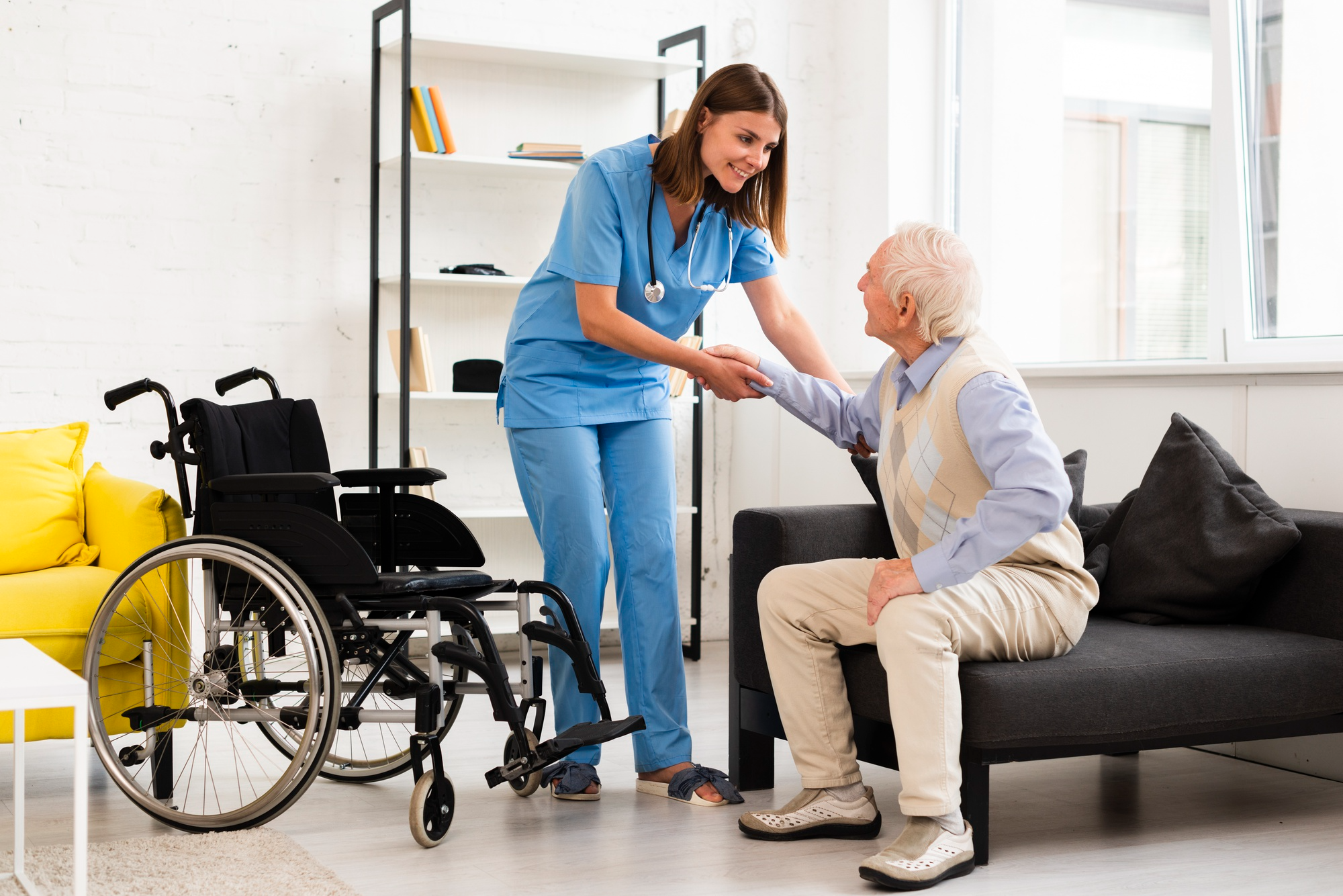Caregiver assisting elderly client at home